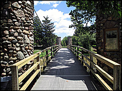 Curwood Castle Nearby footbridge that crosses the Shiawassee River.
