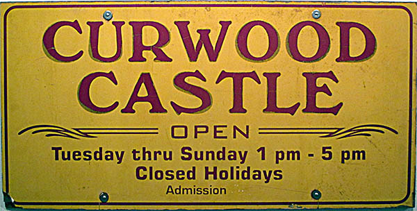 A retired Curwood Castle sign.